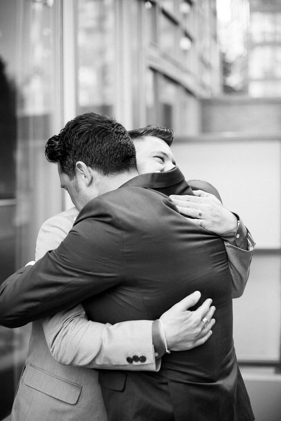 Grooms hugging at Loden Hotel Elopement