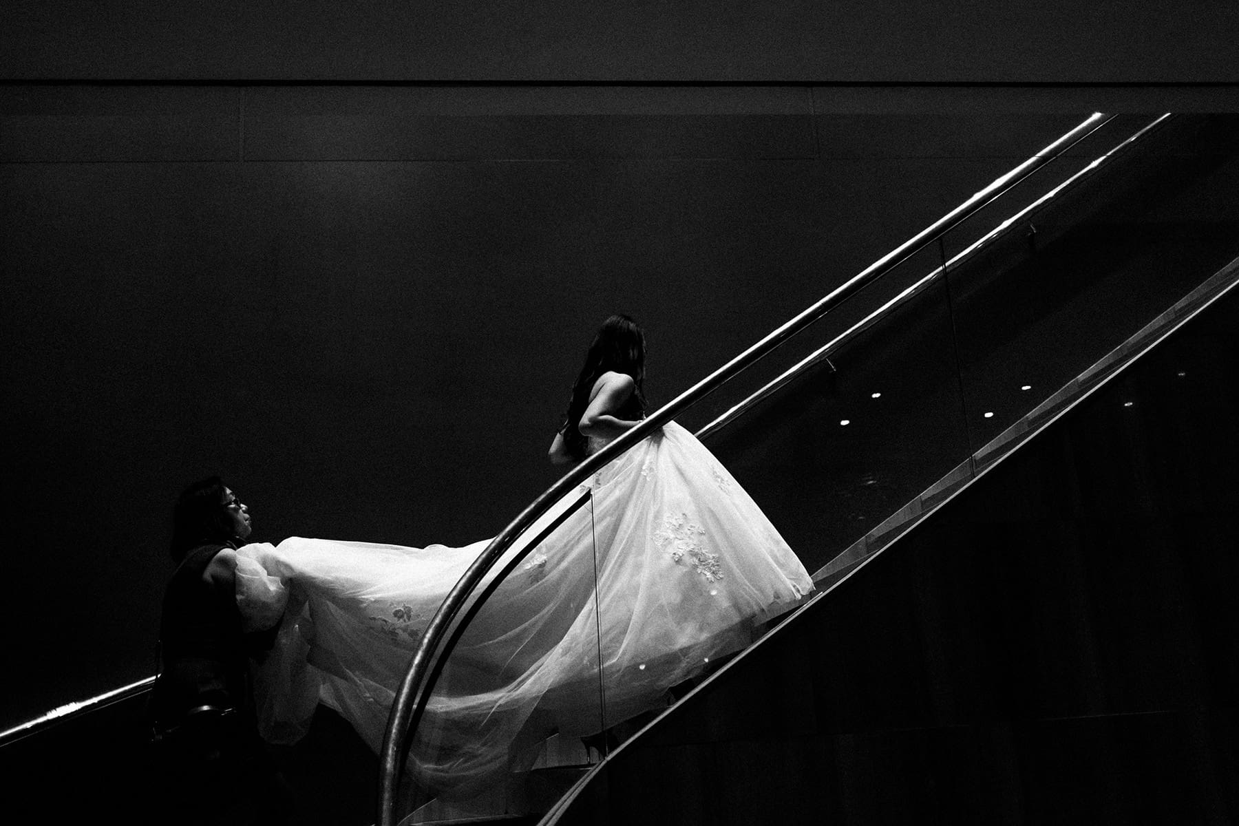 Bride's mother lifts her dress 