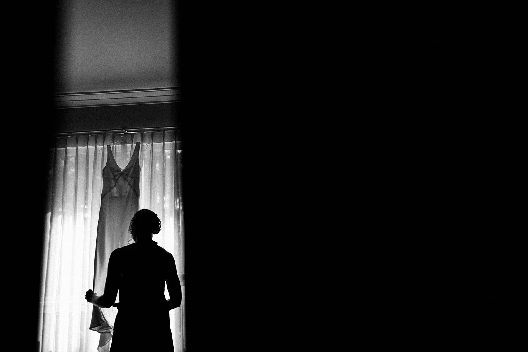 Revelstoke Wedding Photographer Bride hangs her dress