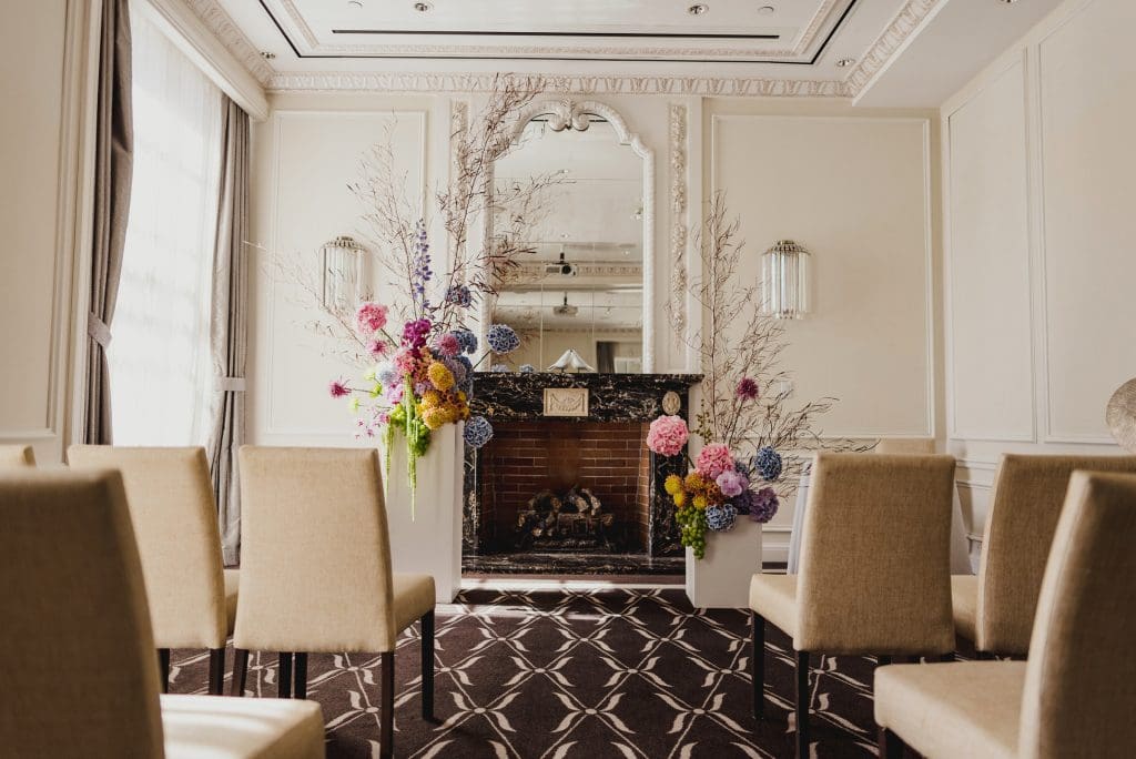Intimate wedding ceremony setup in an elegant room