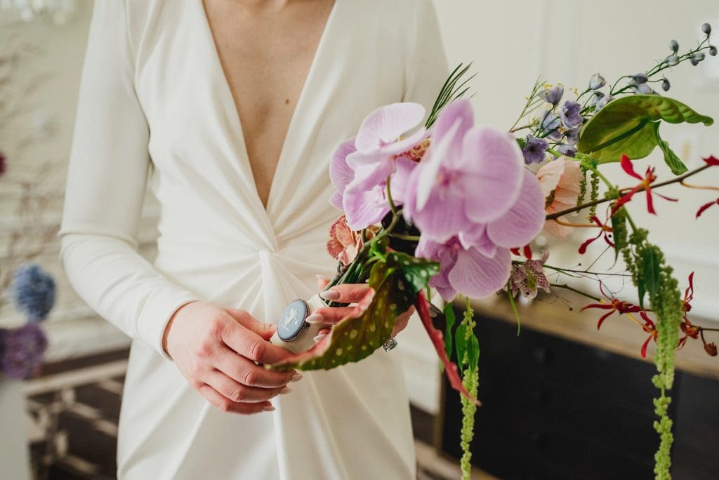 Elegant bridal bouquet of orchids, symbolizing love and beauty.